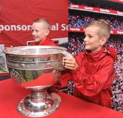 6 August 2011; Patrons have their picture taken with the Sam Maguire cup in the Fanzone ahead of the GAA Football All-Ireland Senior Championship Quarter-Final, Dublin v Tyrone, Croke Park, Dublin. Picture credit: David Maher / SPORTSFILE