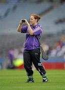7 August 2011; A player takes a photograph during the GAA Camán Abœ Exhibition. Croke Park, Dublin. Picture credit: Ray McManus / SPORTSFILE