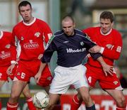 13 March 2002; Tony Grant of Shamrock Rovers in action against Declan Daly and Derek Coughlan of Cork City during the Eircom League Premier Division match between Cork City and Shamrock Rovers at Turners cross in Cork. Photo by David Maher/Sportsfile