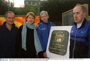 10 March 2002; The President Mary McAleese, accompanied by her husband Martin makes a presentation to Willie O'Mahoney, 2nd from right, and Race Director John Walshe, right, after the Nike/Ballycotton 10, Ballycotton, Co. Cork. Athletics. Picture credit; Ronnie McGarry / SPORTSFILE