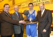 16 March 2002; Waterford Crystal captain Eamonn Sheehan, 3rd from left, is presented with the ESB Men's Superleague Championship trophy by, from left, Maurice Cummins, Deputy Mayor of Waterford, Ronan O'hOgartaigh, Customer Services Manager, South East Region, ESB and Tony Colgan, President of the Irish Basketball Association. ESB Men's Superleague, Waterford Crystal, v SX3 Star, Waterford Institute of Technology, Waterford. Basketball. Picture credit; Brendan Moran / SPORTSFILE *EDI*