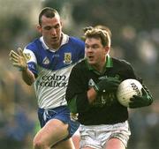 17 March 2002; John P. O'Neill of Nemo Rangers in action against Ronan McGuckian of Ballinderry during the AIB All-Ireland Club Football Championship Final match between Ballinderry Shamrocks and Nemo Rangers at Semple Stadium inThurles, Tipperary. Photo by Brendan Moran/Sportsfile