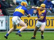 18 March 2002; Michael Jordan of Wexford in action against Paul Ormonde of Tipperary during the Allianz National Hurling League Division 1B Round 4 match between Wexford and Tipperary at Wexford Park in Wexford.  Photo by Aoife Rice/Sportsfile