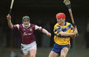 18 March 2002; Brian Lohan of Clare clears from Eugene Cloonan of Galway during the Allianz National Hurling League Division 1A Round 3 match between Galway and Clare at Duggan Park in Ballinasloe, Galway. Photo by Ray McManus/Sportsfile