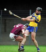 18 March 2002; Sean McMahon of Clare clears under pressure from Eugene Cloonan of Galway during the Allianz National Hurling League Division 1A Round 3 match between Galway and Clare at Duggan Park in Ballinasloe, Galway. Photo by Ray McManus/Sportsfile