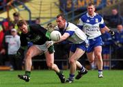 17 March 2002; Ronan McGuckin of Ballinderry challenges John P O'Neill of Nemo Rangers during the AIB All-Ireland Club Football Championship Final match between Ballinderry Shamrocks and Nemo Rangers at Semple Stadium inThurles, Tipperary. Photo by Brendan Moran/Sportsfile