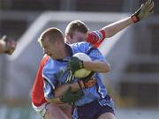 10 March 2002; Declan Darcy of Dublin is tackled by Nicholas Murphy of Cork during the Allianz National Football League Division 1A Round 4 match between Cork and Dublin at Pairc Ui Chaoimh in Cork. Photo by Brendan Moran/Sportsfile