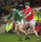25 February 2002; TJ Ryan of Limerick in action against Mark Landers of Cork during the Allianz National Hurling League Division 1B Round 1 match between Limerick and Cork at the Gaelic Grounds in Limerick. Photo by Brendan Moran/Sportsfile
