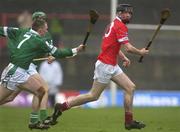 25 February 2002; Kieran Murphy of Cork in action against Mark Foley of Limerick during the Allianz National Hurling League Division 1B Round 1 match between Limerick and Cork at the Gaelic Grounds in Limerick. Photo by Brendan Moran/Sportsfile