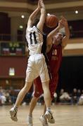 24 March 2002; Barnaby Craddock of Tralee is fouled by Paddy Kelly of Killester during the ESB Men's National Championships Final between Frosties Tigers Tralee and Dart Killester at the National Exhibition Centre in Killarney, Kerry. Photo by Brendan Moran/Sportsfile