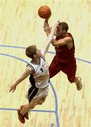 24 March 2002; Barnaby Craddock of Frosties Tralee shoots for two despite the attentions of Jonathan Grennell of Killester during the ESB Men's National Championships Final between Frosties Tigers Tralee and Dart Killester at the National Exhibition Centre in Killarney, Kerry. Photo by Brendan Moran/Sportsfile
