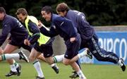 25 March 2002; Players from left, David Connolly, Gary Kelly and Kenny Cunningham during a Republic of Ireland squad training session at John Hyland Park in Baldonnel, Dublin. Photo by David Maher/Sportsfile