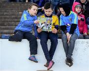 5 March 2017; Young Roscommon supporters, from left, Ryan Dunleavy, Kian Mulligan and Sean Vaughan read the match programme before the Allianz Football League Division 1 Round 4 match between Roscommon and Kerry at Dr Hyde Park in Roscommon. Photo by Stephen McCarthy/Sportsfile