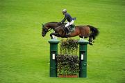 3 August 2011; Hans-Dieter Dreher, Germany, competing on Magnus Romeo, during the Irish Sports Council Classic. Dublin Horse Show 2011, RDS, Ballsbridge, Dublin. Picture credit: Barry Cregg / SPORTSFILE