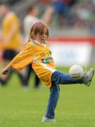 9 July 2011; Antrim supporter Grace Prenter, aged 4, from Rathfarnham, Dublin, kicks a ball around during half-time. Her father Eamonn played for Antrim in the 1980s. GAA Hurling All-Ireland Senior Championship Phase 3, Antrim v Limerick, Parnell Park, Dublin. Picture credit: Ray McManus / SPORTSFILE