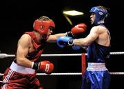 11 August 2011; Jason Quigley, Finn Valley, left, exchanges punches with Andrew Jennings, St. Catherines, during their 75kg Quarter-Final bout. IABA Senior Open Elite Competition 2011, National Stadium, Dublin. Picture credit: Brian Lawless / SPORTSFILE
