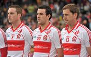 17 July 2011; Derry players, from left, Joe Diver, Caolan O'Boyle and Enda Muldoon stand for the team photograph before the game. Ulster GAA Football Senior Championship Final, Derry v Donegal, St Tiernach's Park, Clones, Co. Monaghan. Picture credit: Brendan Moran / SPORTSFILE