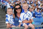7 August 2011; Sharon Carey Kelly and her two sons, Sean, left, five years, and Fionn, six years, cheer on Waterford and Eoin Kelly during the GAA Hurling All-Ireland Senior Championship Semi-Final, Kilkenny v Waterford, Croke Park, Dublin. Picture credit: Ray McManus / SPORTSFILE