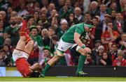 10 March 2017; CJ Stander of Ireland evades the tackle of Leigh Halfpenny of Wales during the RBS Six Nations Rugby Championship match between Wales and Ireland at the Principality Stadium in Cardiff, Wales. Photo by Stephen McCarthy/Sportsfile