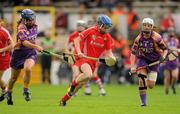 13 August 2011; Briege Corkery, Cork, in action against Aoife O'Connor, left, and Karen Atkinson, right, Wexford. All-Ireland Senior Camogie Championship Semi-Final in association with RTE Sport, Cork v Wexford, Nowlan Park, Kilkenny. Picture credit: Pat Murphy / SPORTSFILE