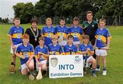 14 August 2011; Vice President of the I.N.T.O. Anne Fay with the Tipperary hurling team, back row, left to right, Jason Power, Glenville N.S., Glenville, Co. Cork, Cilian Byrne, St. Colmcille’s N.S. Knocklyon, Co. Dublin, Cathal Geary, Scoil Mhuire, Tallow, Co. Waterford, Michael Barlow, Ardfinnan N.S., Clonmel, Co. Tipperary, Eugene Fitzgibbon, coach, and Cormac Doyle, C.B.S., Doon, Co. Limerick, front row, left to right, Alan Duggan, Briehill N.S., Co. Galway, Ian Condon, St. Stepehn’s N.S., Co. Waterford, Diarmuid Carney, St. Michael’s N.S., Cootehill, Co. Cavan, Cormac Timoney, St. Felim’s N.S., Ballinagh, Co. Cavan, and Nicholas Mac an Rí, Scoil Mobhi, Glasnaoin, Co. Dublin. Go Games Exhibition - Sunday 14th August 2011, Clonliffe College,  Dublin. Picture credit: Ray McManus / SPORTSFILE
