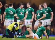 10 March 2017; Tommy Bowe of Ireland is treated by Dr Ciaran Cosgrave, Ireland team doctor, during the RBS Six Nations Rugby Championship match between Wales and Ireland at the Principality Stadium in Cardiff, Wales. Photo by Stephen McCarthy/Sportsfile