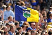 14 August 2011; A Tipperary supporter waves a flag at the GAA Hurling All-Ireland Senior Championship Semi-Final, Croke Park, Dublin. Picture credit: Ray McManus / SPORTSFILE