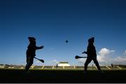 12 March 2017; Galway supporters Elliott Keogh, aged 5, left, and Morgan Keogh, aged 7, from Briarfield, Co. Galway, practice their skills on the pitch before the Allianz Hurling League Division 1B Round 4 match between Kerry and Galway at Austin Stack Park in Tralee, Co. Kerry. Photo by Diarmuid Greene/Sportsfile