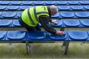 12 March 2017; Martin Keane of the Michael Cusack club cleans down seats on the subs benches before the Allianz Hurling League Division 1A Round 4 match between Clare and Dublin at Cusack Park in Ennis, Co. Clare. Photo by Ray McManus/Sportsfile