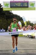 20 August 2011; Jose Carols Hernandez, from Spain, crosses the finish line to win the men's Frank Duffy 10 Mile race, Phoenix Park, Dublin. Picture credit: Pat Murphy / SPORTSFILE