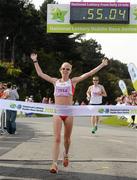 20 August 2011; Gemma Marie Steel, from England, crosses the finish line to win the Women's Frank Duffy 10 Mile race, Phoenix Park, Dublin. Picture credit: Pat Murphy / SPORTSFILE