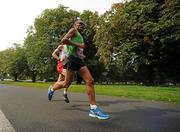 20 August 2011; Jose Carols Hernandez, from Spain, races clear of England's Anthony Ford, partially hidden, on his way to winning the men's Frank Duffy 10 Mile race, Phoenix Park, Dublin. Picture credit: Pat Murphy / SPORTSFILE