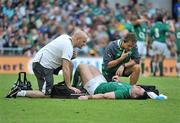 20 August 2011; Cian Healy, Ireland, receives medical attention from team doctor, Dr. Eanna Falvey, and physio Cameron Steele. Rugby World Cup Warm-up game, Ireland v France, Aviva Stadium, Lansdowne Road, Dublin. Picture credit: Brendan Moran / SPORTSFILE