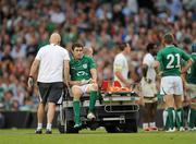 20 August 2011; Felix Jones, Ireland, leaves the pitch with team doctor Dr. Eanna Falvey. Rugby World Cup Warm-up game, Ireland v France, Aviva Stadium, Lansdowne Road, Dublin. Picture credit: Stephen McCarthy / SPORTSFILE