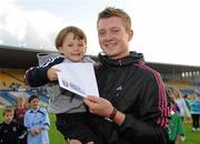 20 August 2011; Galway hurler Joe Canning with his nephew Andrew Canning aged 4 from Portumna, with his prize from Bord Gais Energy, after winning the Crossbar Challenge at half-time  in the now famous Bord Gáis Energy Crossbar Challenge during the Bord Gáis Energy GAA Hurling Under 21 All-Ireland Championship Semi-Final between Galway and Limerick. Semple Stadium, Thurles, Co. Tipperary. Picture credit: Barry Cregg / SPORTSFILE