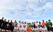 13 March 2017; Birds fly overhead as the teams stand for a group photo following the Colleges & Universities and Defence Forces match at Home Farm FC, in Whitehall, Dublin. Photo by David Fitzgerald/Sportsfile
