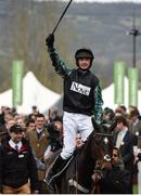 14 March 2017; Nico de Boinville celebrates as he enters the winners enclosure after winning the Racing Post Arkle Challenge Trophy Novices' Steeple Chase on Altior during the Cheltenham Racing Festival at Prestbury Park, in Cheltenham, England. Photo by Seb Daly/Sportsfile