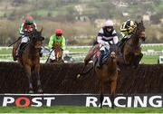 14 March 2017; Un Temps Pour Tout, left, with Tom Scudamore up, jumps the last alongside Singlefarmpayment, with Adrian Heskin up, who finished second, on their way to winning the Ultima Handicap Steeple Chase during the Cheltenham Racing Festival at Prestbury Park, in Cheltenham, England. Photo by Seb Daly/Sportsfile