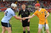 20 August 2011; Dublin captain Liam Rushe shakes hands with Antrim captain Conor McCann in the company of referee Fergus Smith. Bord Gais Energy GAA Hurling Under 21 All-Ireland Championship Semi-Final, Antrim v Dublin, Pairc Esler, Newry, Co. Down. Picture credit: Oliver McVeigh / SPORTSFILE