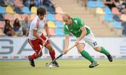 21 August 2011; Eugene Magee, Ireland, in action against Adam Dixon, England. GANT EuroHockey Nations Men's Championships 2011, Ireland v England, Warsteiner HockeyPark, Mönchengladbach, Germany. Picture credit: Diarmuid Greene / SPORTSFILE