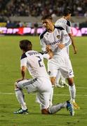 20 August 2011; David Beckham, LA Galaxy, right, helps up team-mate Todd Dunivant. MLS, LA Galaxy v San Jose Earthquakes, The Home Depot Center, Carson, California, USA. Picture credit: Jake Roth / SPORTSFILE