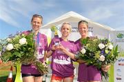 20 August 2011; Winner Gemma Marie Steel, England, with second placed Maria McCambridge, Donegal, left, and third placed Helen Jane Decker, England, right, after the National Lottery Frank Duffy 10 Mile race, Phoenix Park, Dublin. Picture credit: Pat Murphy / SPORTSFILE
