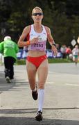 20 August 2011; Helen Jane Decker, from England, finishes in third place in the Womens National Lottery Frank Duffy 10 Mile race, Phoenix Park, Dublin. Picture credit: Pat Murphy / SPORTSFILE