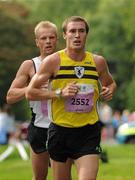 20 August 2011; Stephen Scullion, from Belfast, Co. Antrim, right, races clear of Martin Williams, Scotland, left, during the National Lottery Frank Duffy 10 Mile race, Phoenix Park, Dublin. Picture credit: Pat Murphy / SPORTSFILE