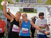 20 August 2011; Yvonne Bolger and her sister Rachel, right, celebrate after finishing the National Lottery Frank Duffy 10 Mile race, Phoenix Park, Dublin. Picture credit: Pat Murphy / SPORTSFILE