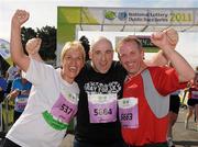 20 August 2011; Fiona Browne, left, John Kennedy, centre, and Joe Wogan, right, all from Dublin, celebrate after finishing the National Lottery Frank Duffy 10 Mile race, Phoenix Park, Dublin. Picture credit: Pat Murphy / SPORTSFILE