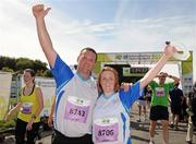 20 August 2011; Philip Brennan and Emma-Louise Brennan, from Louth, celebrates after finishing the National Lottery Frank Duffy 10 Mile race, Phoenix Park, Dublin. Picture credit: Pat Murphy / SPORTSFILE