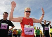 20 August 2011; Sally Tipping, from Louth, celebrates after finishing the National Lottery Frank Duffy 10 Mile race, Phoenix Park, Dublin. Picture credit: Pat Murphy / SPORTSFILE