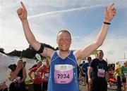 20 August 2011; Alan O'Toole, from Dublin, celebrates after finishing the National Lottery Frank Duffy 10 Mile race, Phoenix Park, Dublin. Picture credit: Pat Murphy / SPORTSFILE
