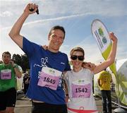 20 August 2011; Paul Whelan and Clodagh Moriarty, both from Dublin, celebrate after finishing the National Lottery Frank Duffy 10 Mile race, Phoenix Park, Dublin. Picture credit: Pat Murphy / SPORTSFILE